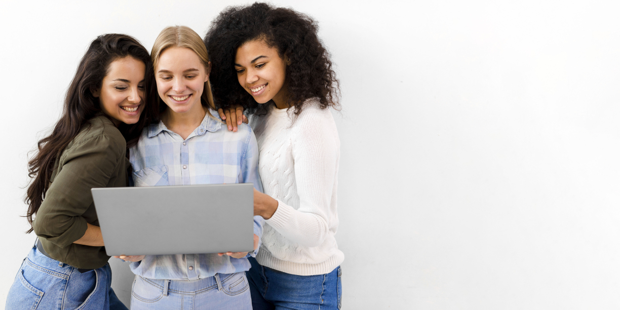 Group of business women browsing a laptop